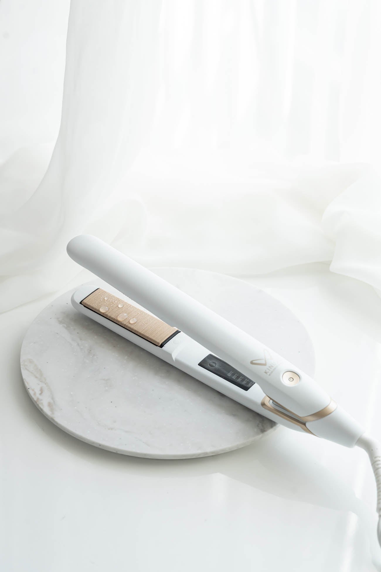 KINUJO W Straight Iron resting on a marble tray